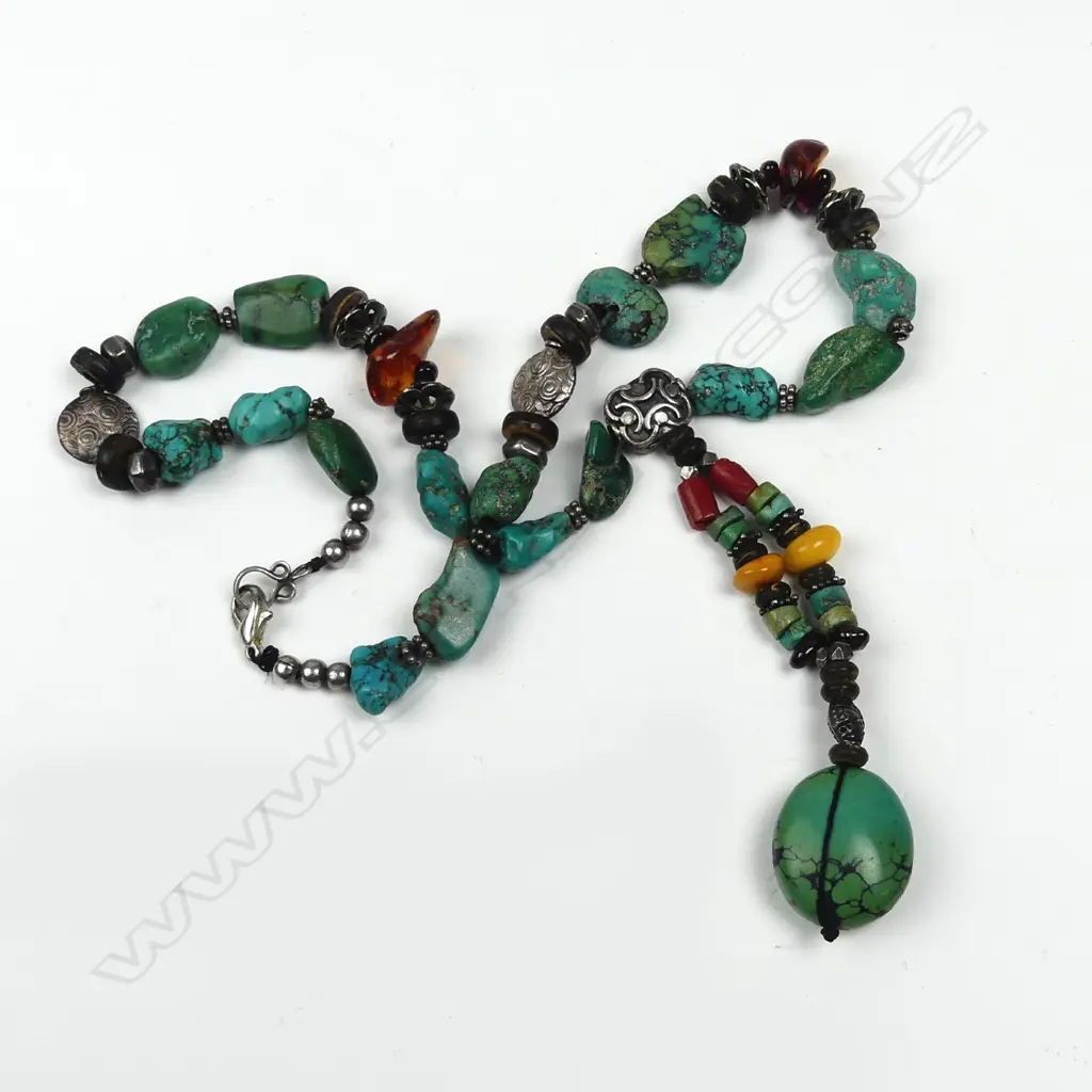A tribal turquoise and other bead necklace Image 1++