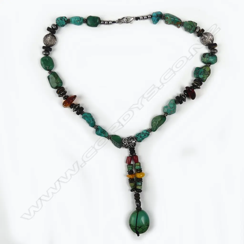 A tribal turquoise and other bead necklace Image 1++