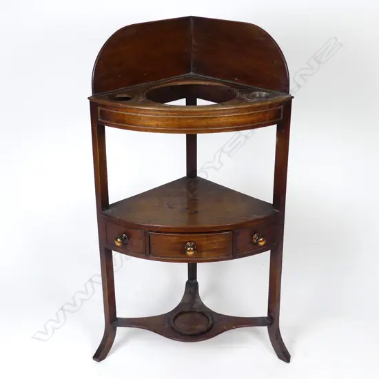 A George III mahogany corner washstand