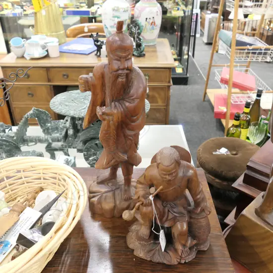 TWO SMALL CARVED WOODEN ASIAN FIGURES, TWO MEN. 