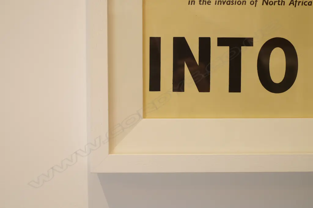 A framed WWII propaganda poster Image 1++