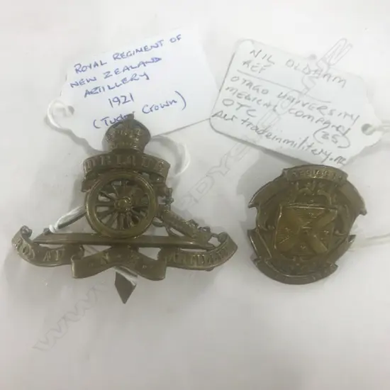 ROYAL REGT of NZ ARTILLERY [1921]; OFFICER TRAINING CORPS [OTAGO UNI MEDICAL CPY] BADGES (2)