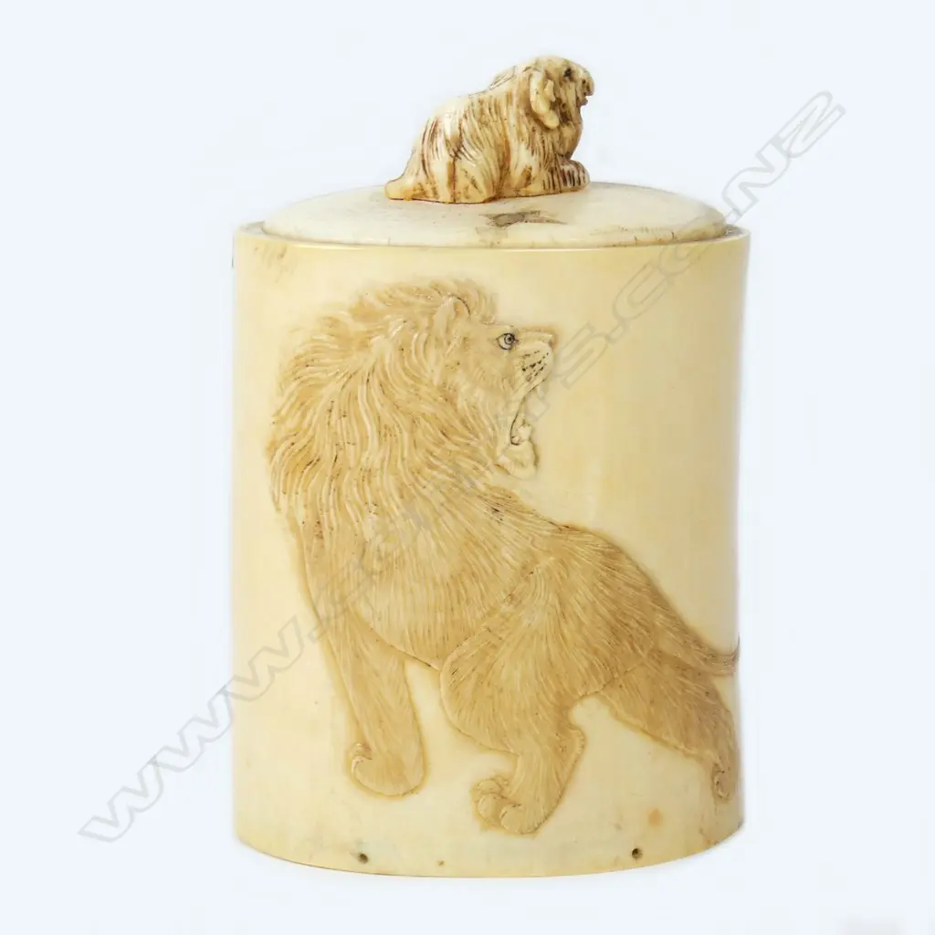 A carved ivory tusk section canister Image 1++