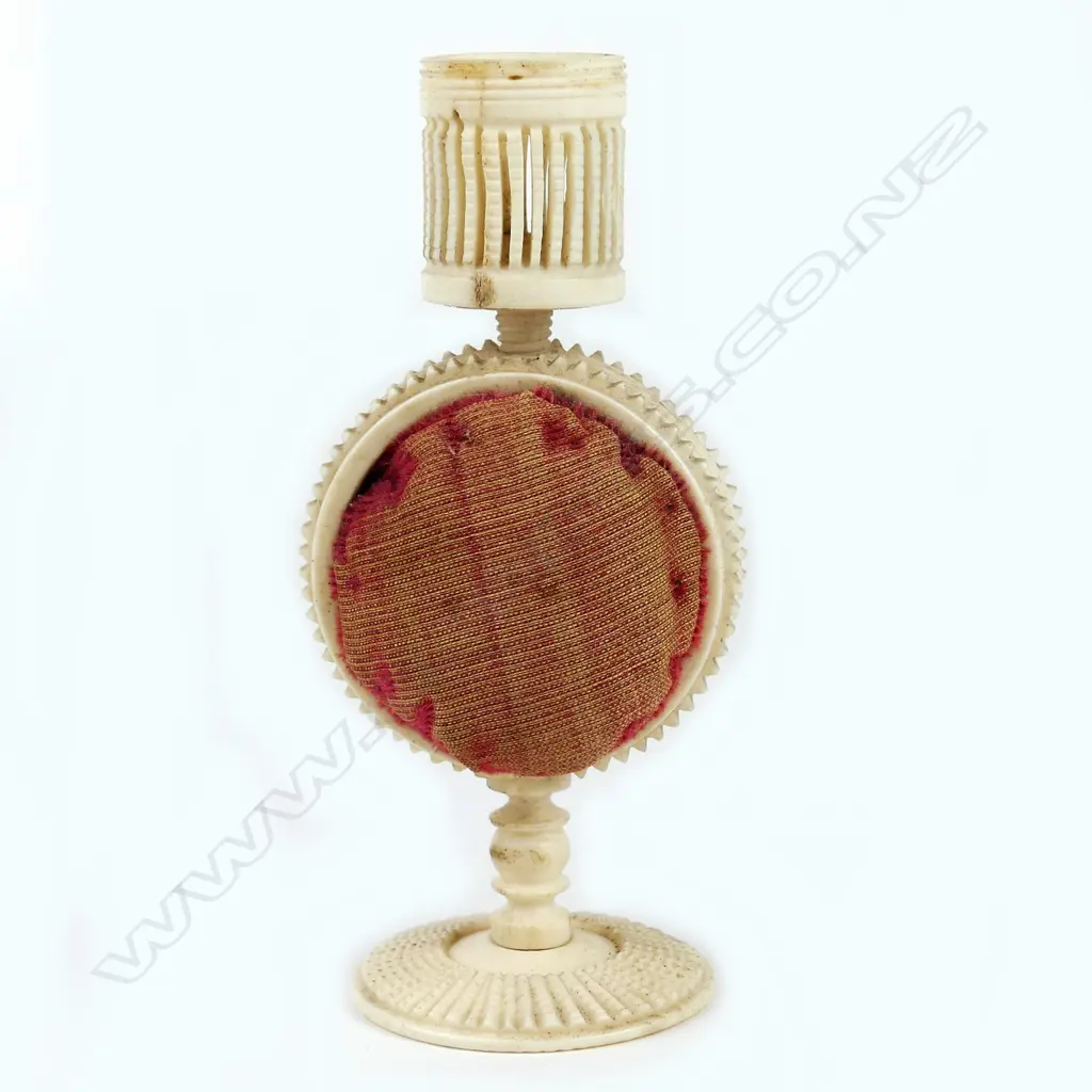A 19thC carved and turned bone pedestal pin cushion combination thimble holder Image 1++