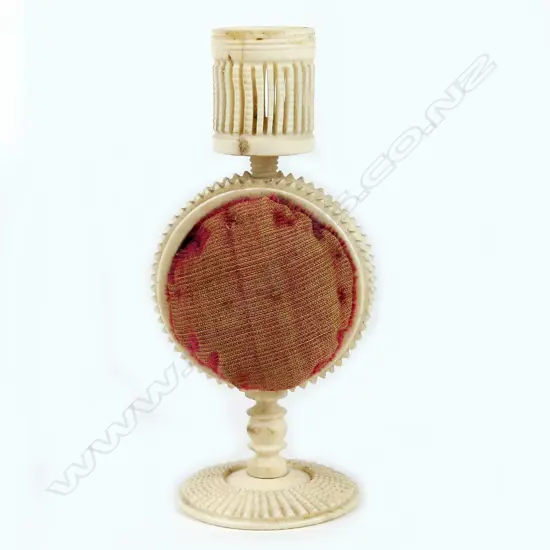 A 19thC carved and turned bone pedestal pin cushion combination thimble holder