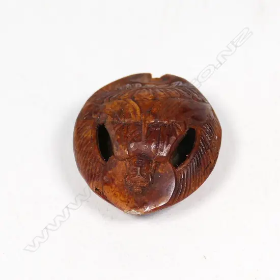 SMALL NUT CARVED WITH BUDDHA