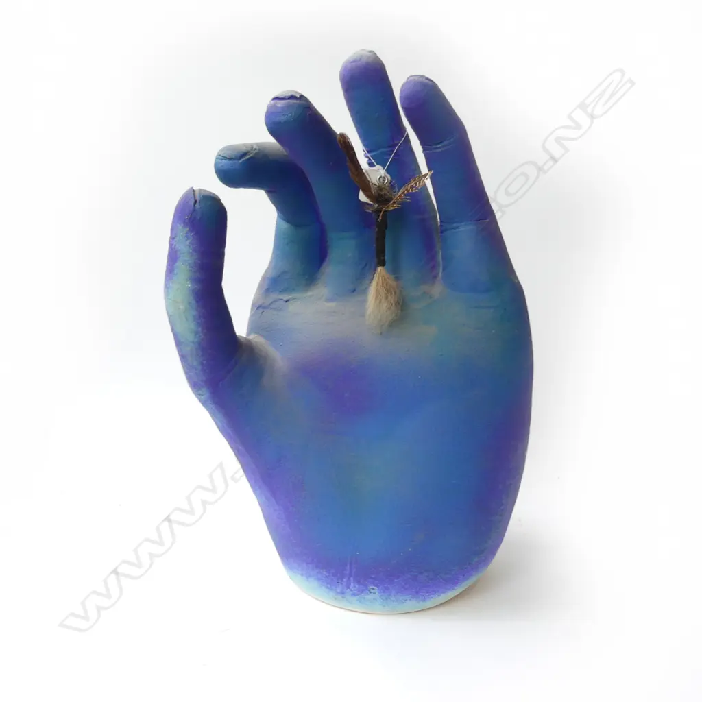 Paul Laird large pottery hand supporting an extra-large fisherman's wet fly Image 1++