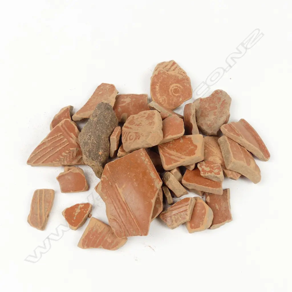 A collection of Ancient Roman terra cotta fragments Image 1++