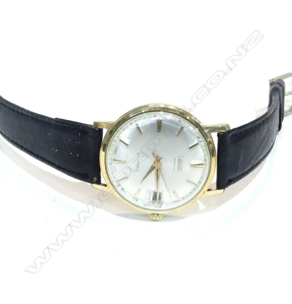 gold plated 34mm case; stainless steel back marked 'Waterproof' (engraved previous owner's name); champagne dial with gold batons indicating hours; Dauphine hands Image 1++