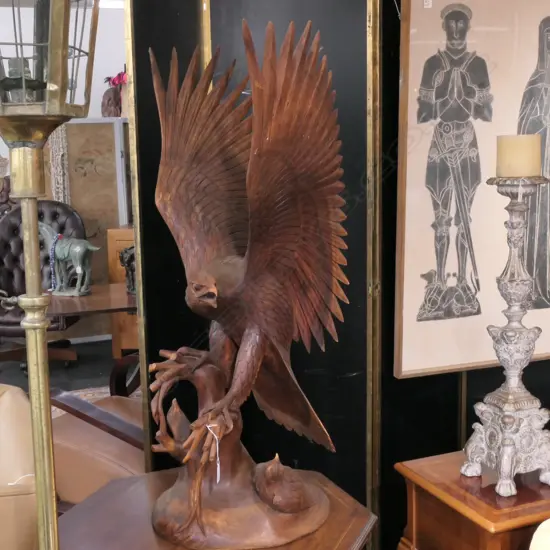 LGE FINELY CARVED EAGLE ALIGHTING ON A ROCK