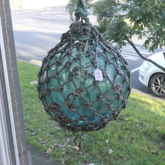 OLD LARGE GLASS FISHING FLOAT WITH NETTING