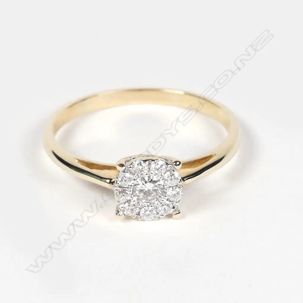 A 9ct gold and diamond ring Image 1++