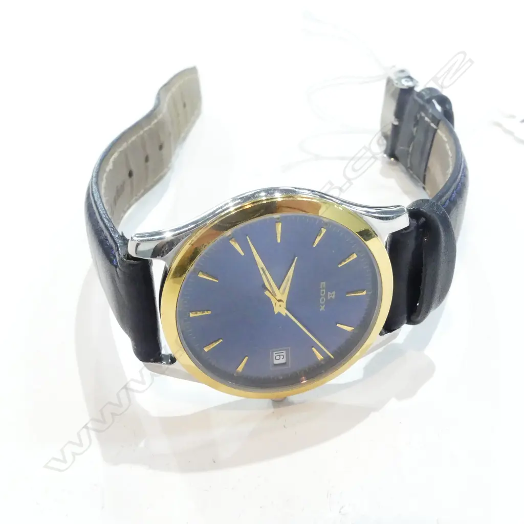 gold plated; stainless steel back; water resistant 5 atmos; sapphire blue dial; Dauphine hands Image 1++