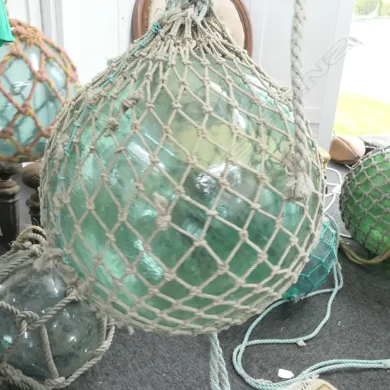 OLD LARGE GLASS FISHING FLOAT WITH NETTING...