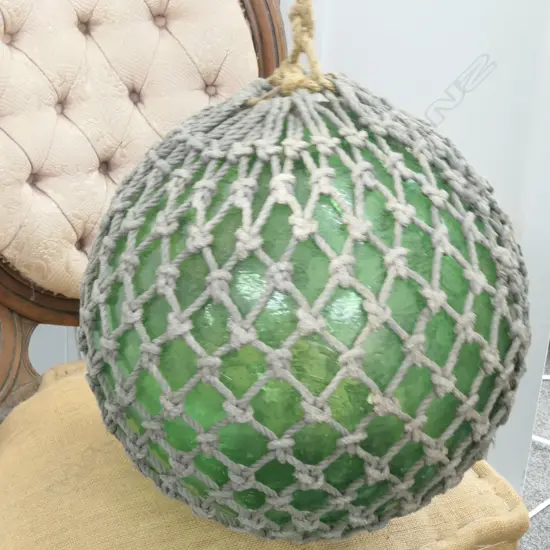 OLD LARGE GLASS FISHING FLOAT WITH NETTING...