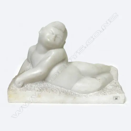 A marble figure of a reclining Chinese child