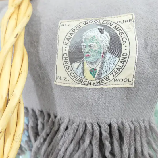 TWO GOOD WOOLLEN BLANKETS; RARE KAIAPOI MILLS MAORI CHIEF LABEL AND CANTERBURY ROBINWUL INCL. BASKET
