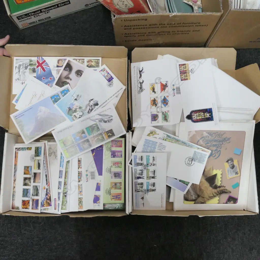 2 BOXES OF U.S STAMPS + N.Z FIRST DAY COVERS Image 1++