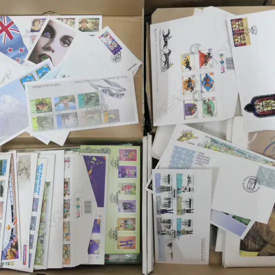 2 BOXES OF U.S STAMPS + N.Z FIRST DAY COVERS