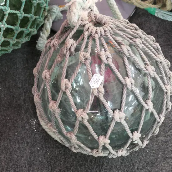 OLD LARGE GLASS FISHING FLOAT WITH NETTING...
