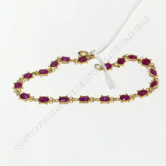 18CT GOLD AND RUBY BRACELET 