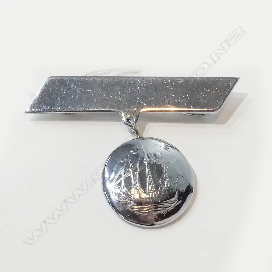 BROOCH WITH DOUBLED SIDED DROP SHOWING MAORI TIKI AND ON REVERSE A SAILING SHIP Image 1++