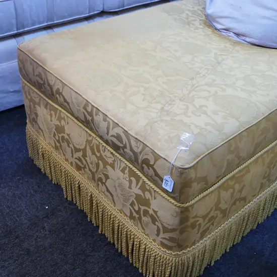 GOLD UPHOLSTERED OTTOMAN