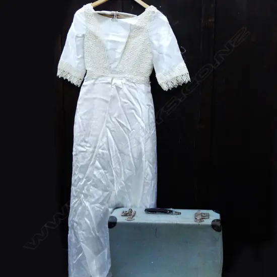 VINTAGE WEDDING DRESS AND OLD SUITCASE