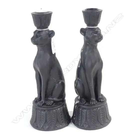 BLACK RESIN CANDLE STICKS IN FORM OF LEOPARDS.