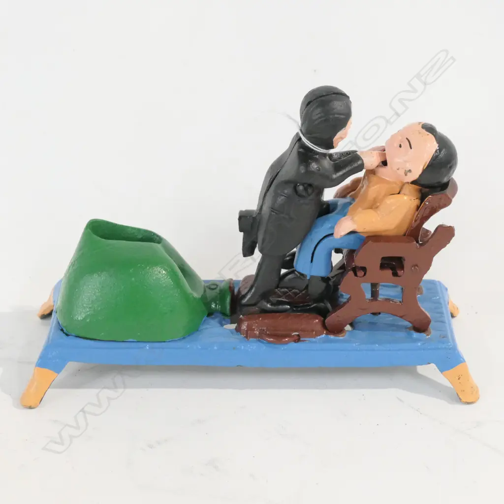 REPRODUCTION CAST IRON DENTIST TOY Image 1++