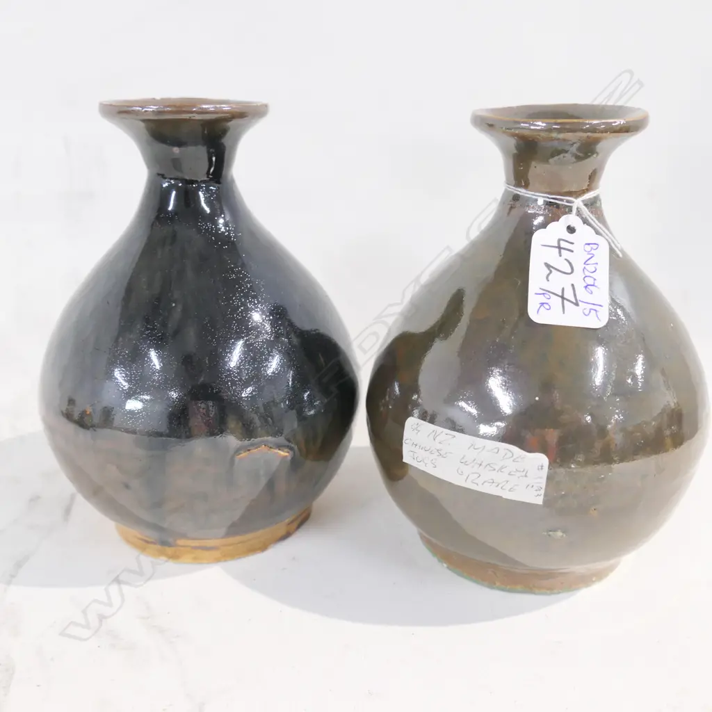 PAIR NZ MADE CHINESE WHISKEY JUGS Image 1++