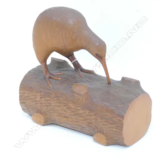 KIWI PERCHED ON A LOG CARVED FROM KAURI