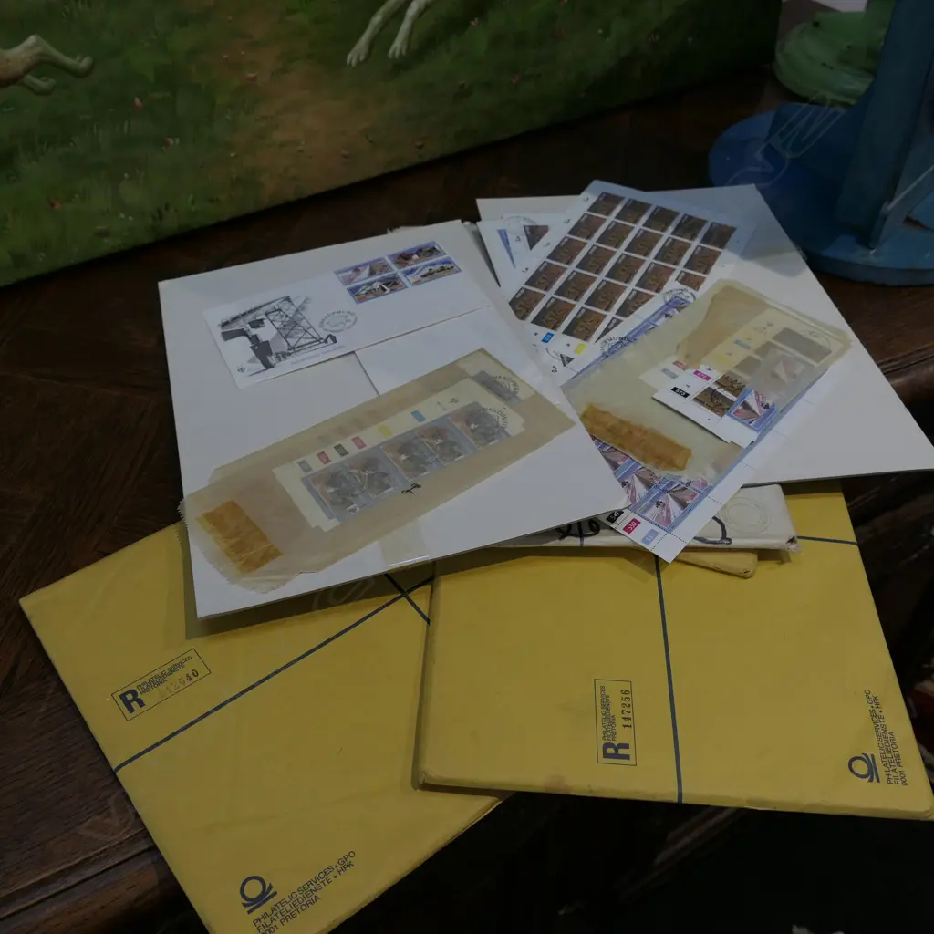 FOUR FOLIOS OF SOUTH AFRICAN STAMPS Image 1++