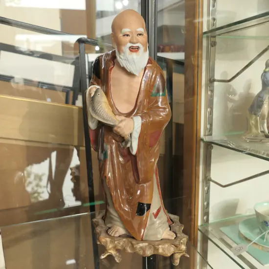 CHINESE FIGURE OF OLD MAN WITH FISH