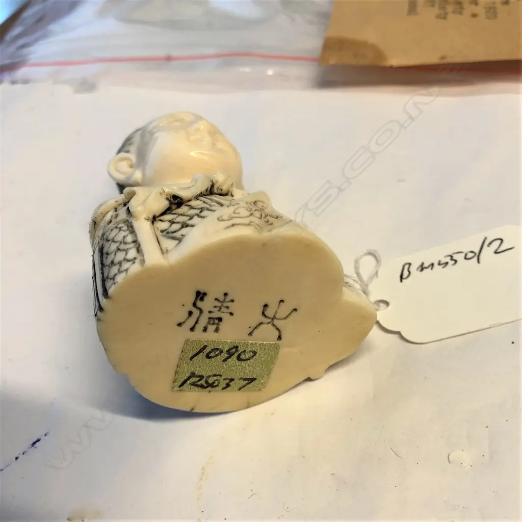 An old Japanese carved ivory snuff bottle as the bust of a woman Image 1++