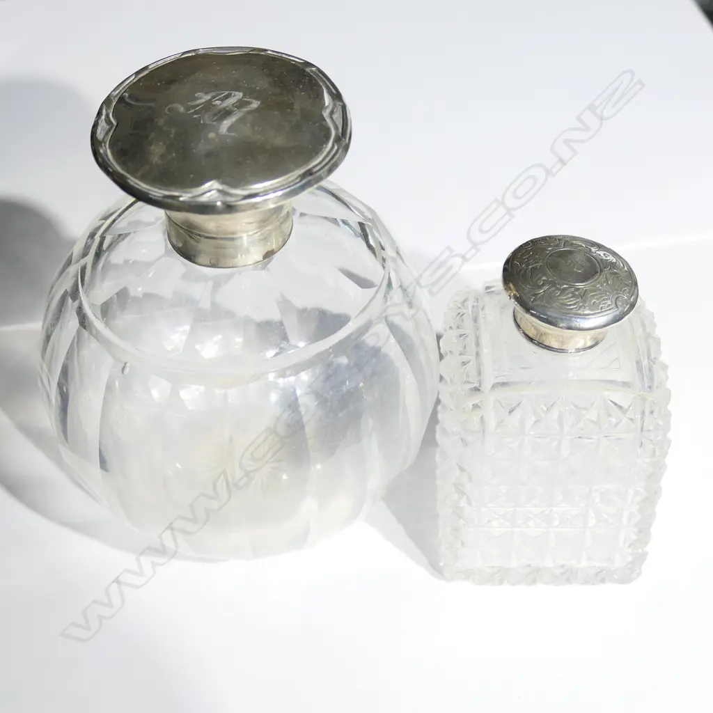 2 STERLING TOPPED GLASS VANIM BOTTLES. LARGEST BEING H. 135MM Image 1++