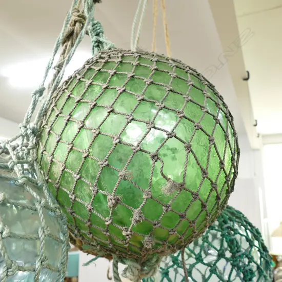OLD LARGE GLASS FISHING FLOAT WITH NETTING...
