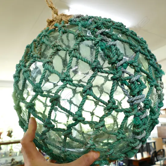 OLD LARGE GLASS FISHING FLOAT WITH NETTING...
