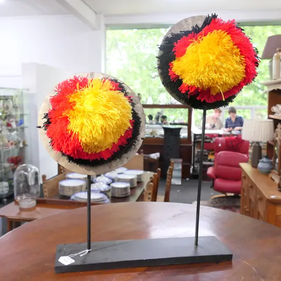 TRIBAL BRONZE DISC SCULPTURE ON STAND...