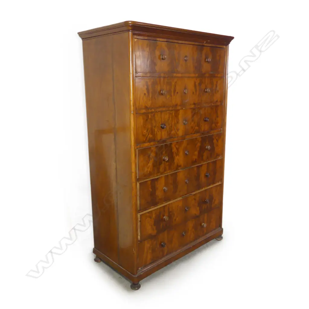 A Victorian flame mahogany seven drawer tallboy Image 1++