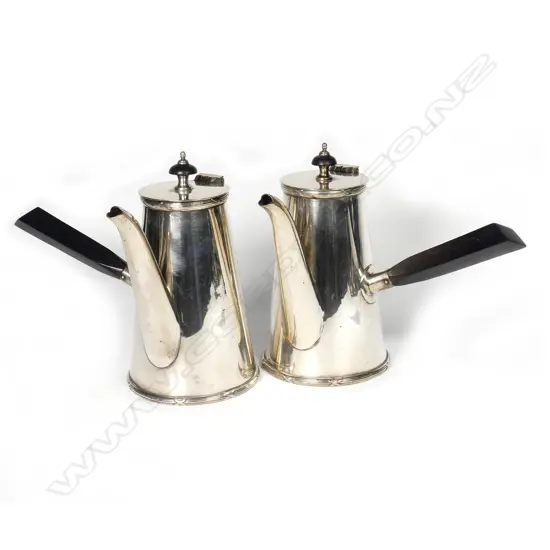 A pair of Edwardian silver plate chocolate pots