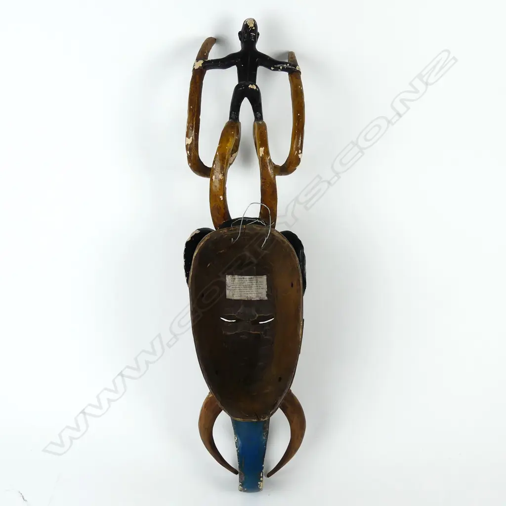 A Baule African tribal carved and painted mask Image 1++