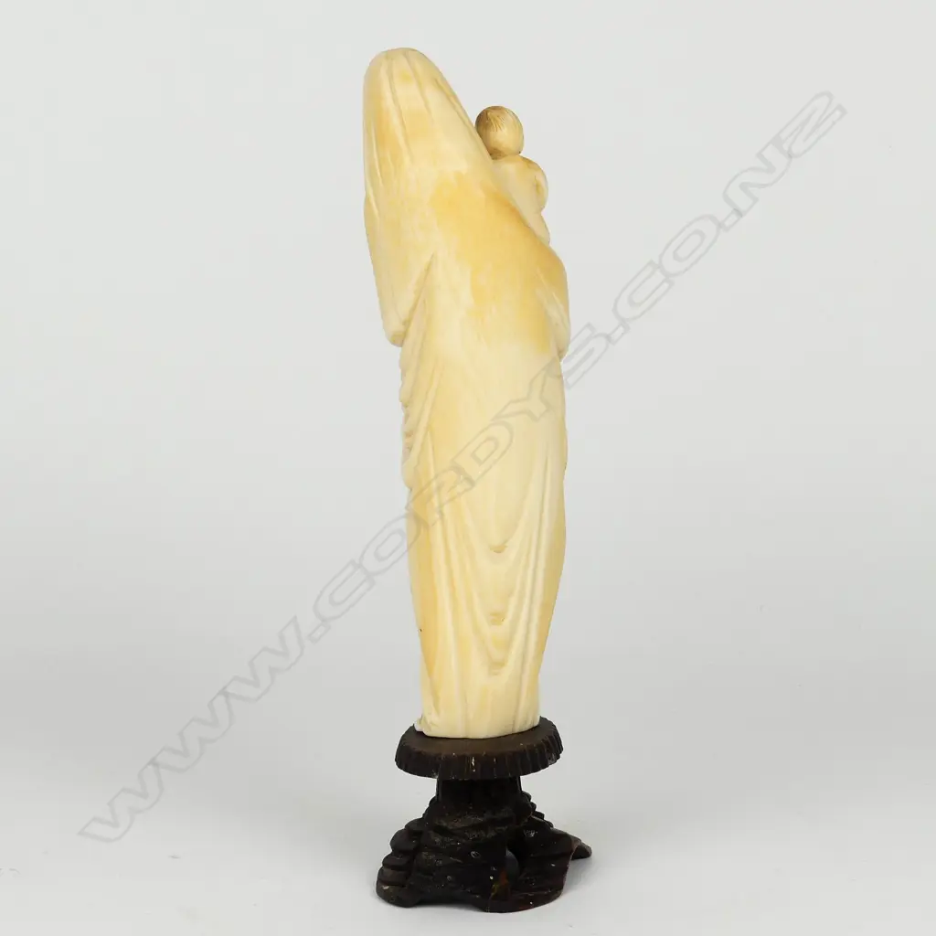 An old carved ivory standing figure of the Madonna and Child Image 1++