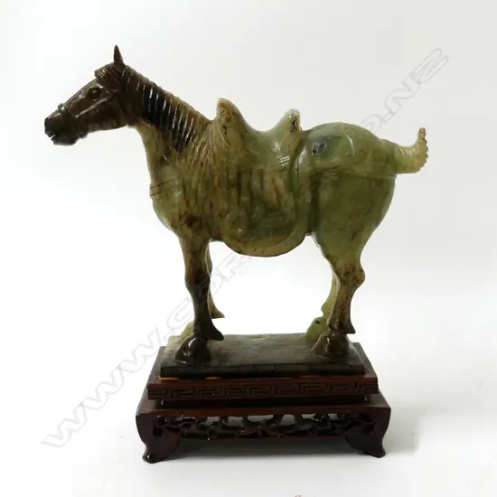 A Chinese carved jade horse