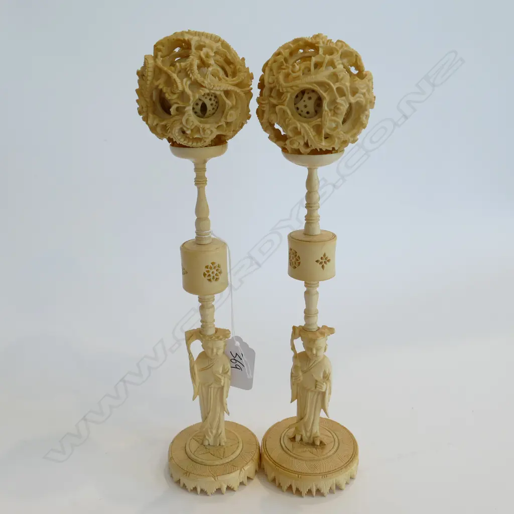 PAIR OF IVORY CARVED MULTI LAYER PUZZLE BALLS RAISED ON FIGURED STANDS. H.250mm Image 1++