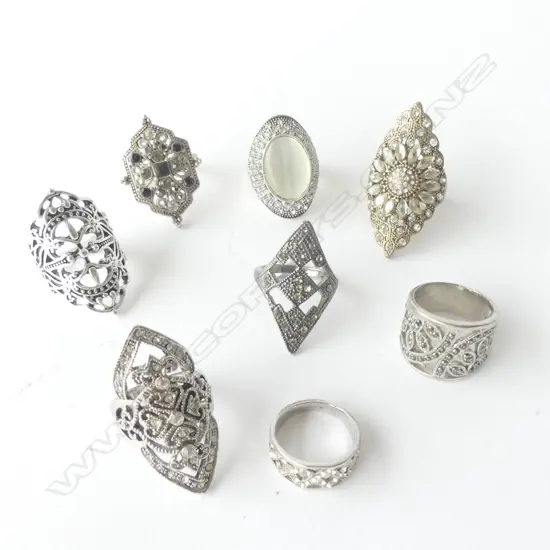 EIGHT LARGE SILVER(?) VINTAGE RINGS