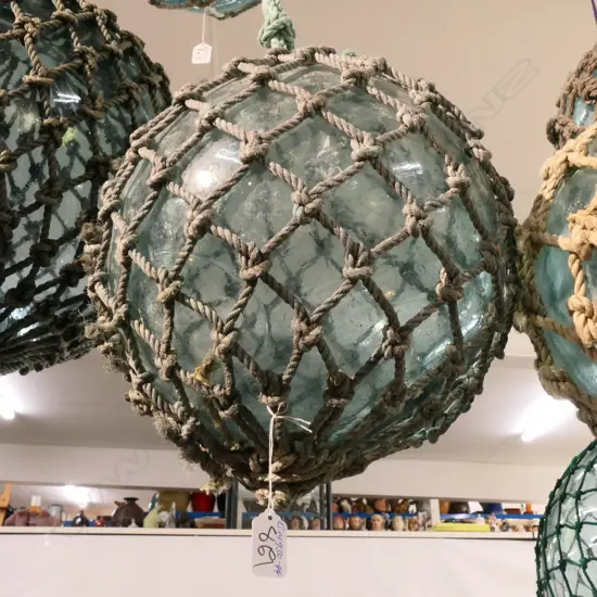 OLD GLASS FISHING FLOAT WITH NETTING...