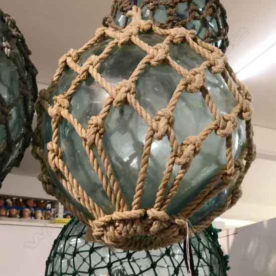 OLD GLASS FISHING FLOAT WITH NETTING...