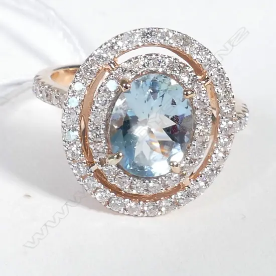 14ct Rose Gold Aquamarine and Diamond ring featuring centre
