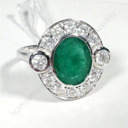 14ct White Gold Emerald and Diamond halo ring featuring centre Image 1++